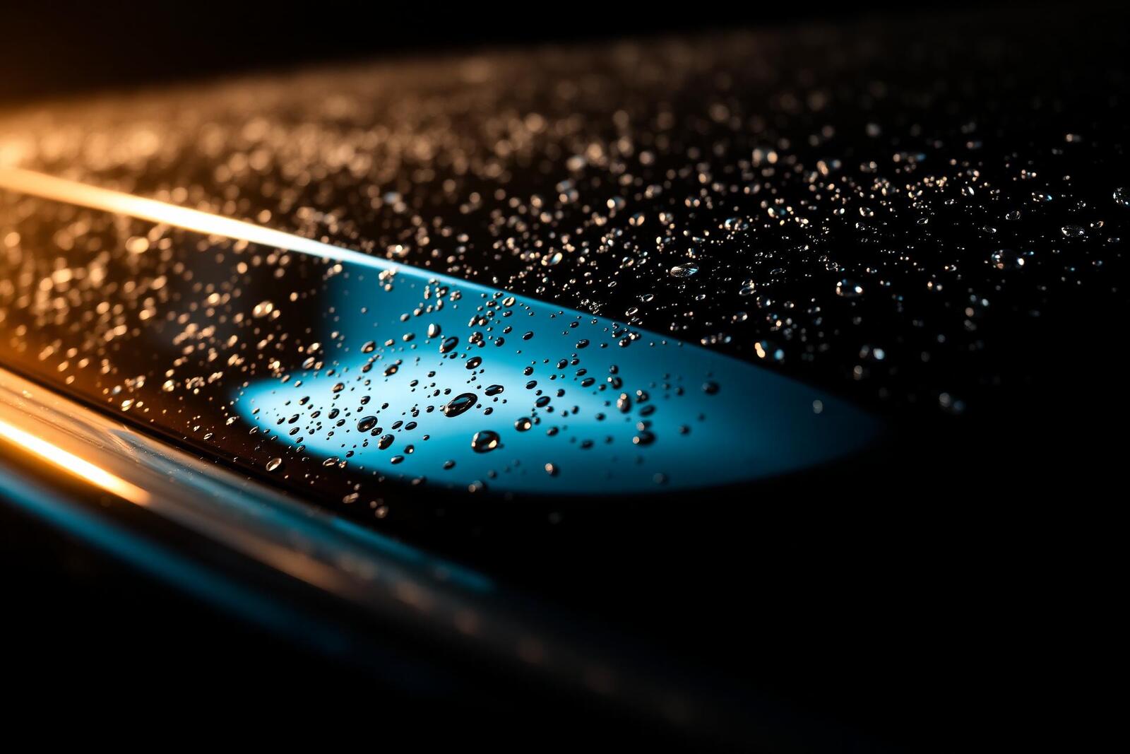 Glossy car paint with water beads after a Living Waters detail